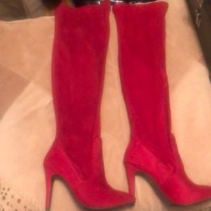 Beautiful barely worn red high-heeled boots.